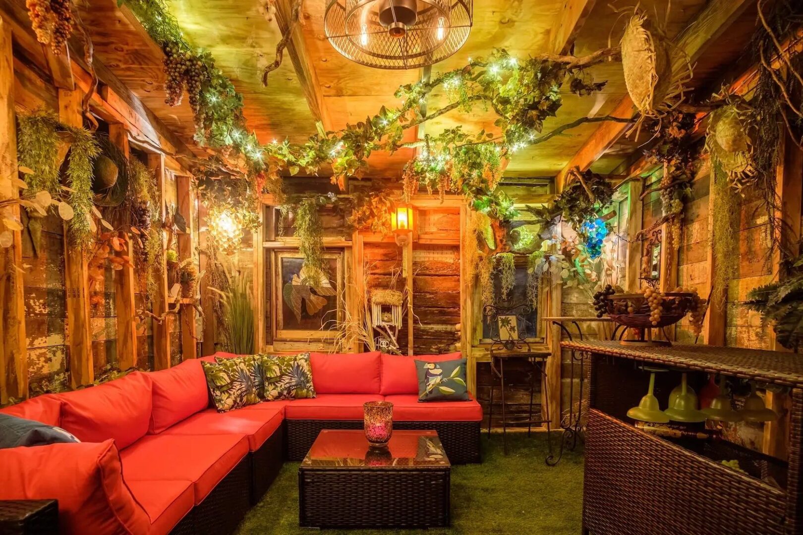 A room with red couches and green walls