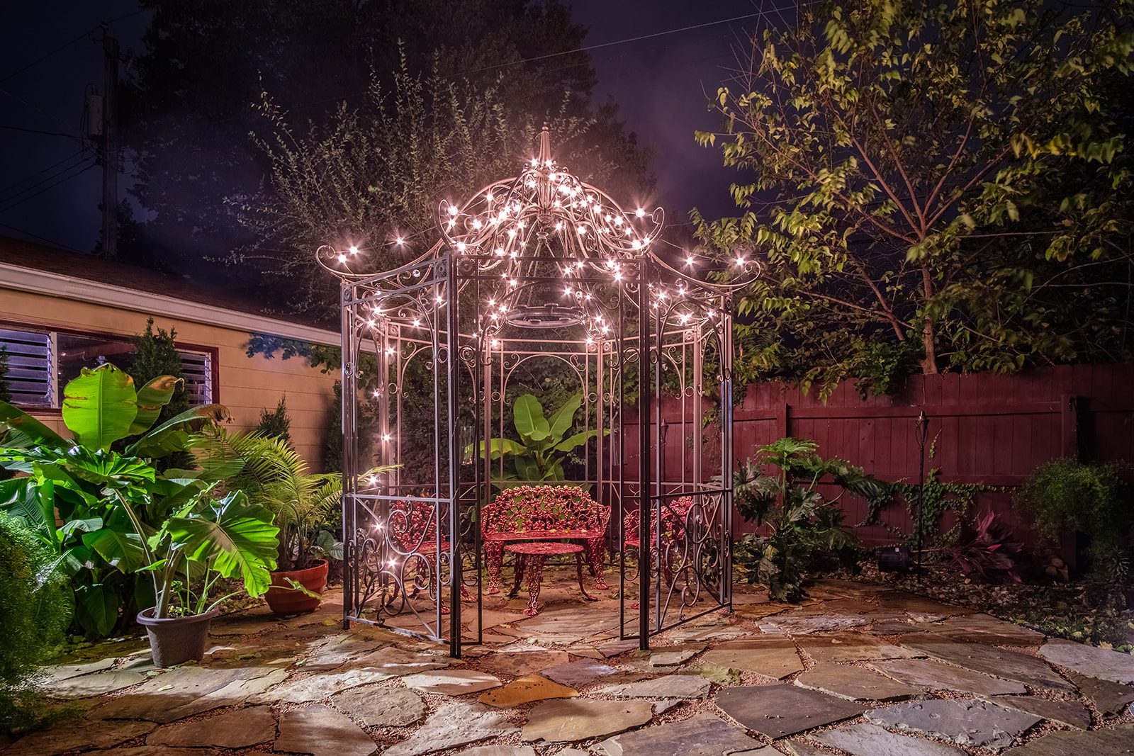 A gazebo with lights on top of it