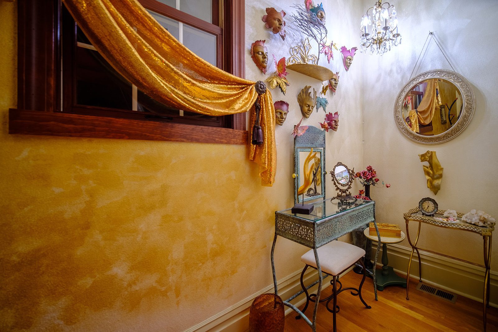 A room with a mirror and a chair