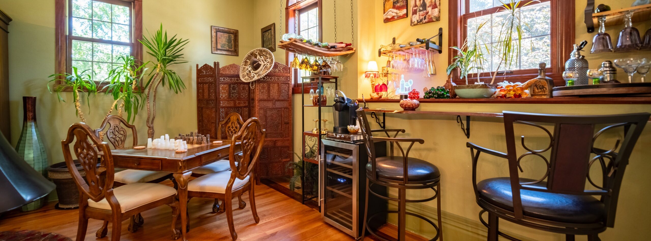 A well-furnished living room with a bar.